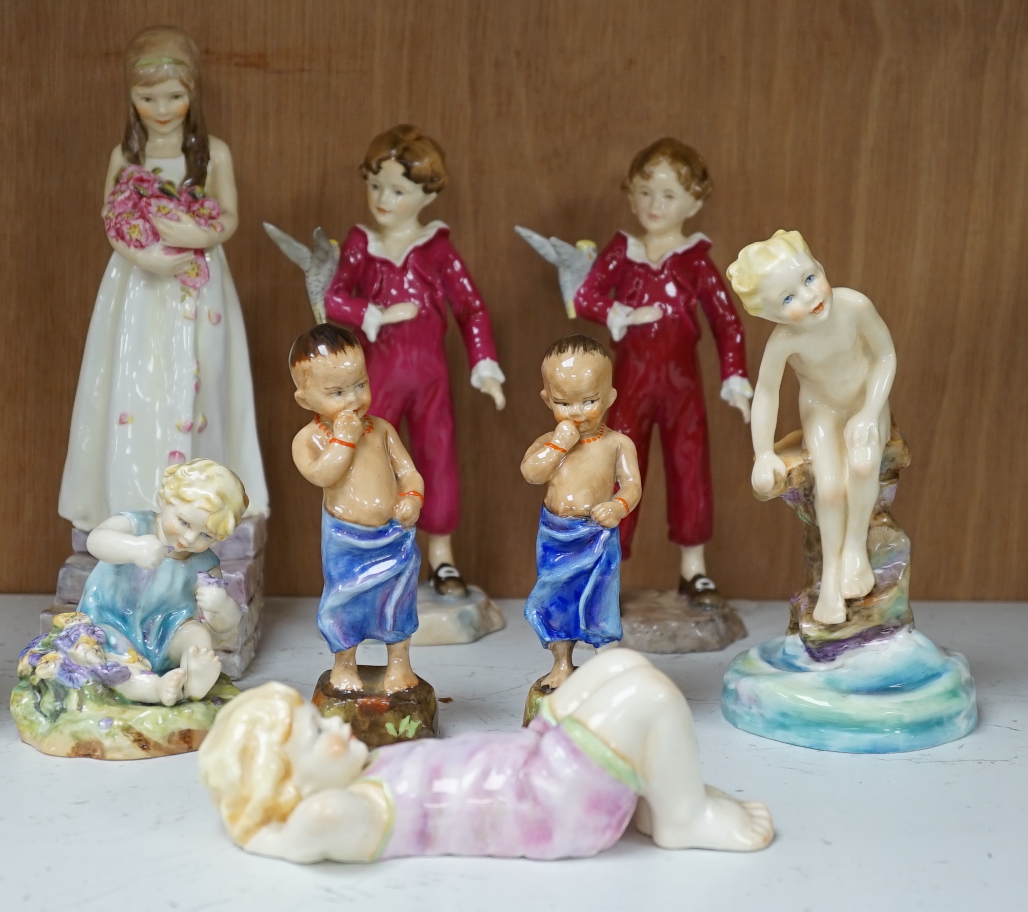 Eight various Royal Worcester F.G. Doughty figures including Happy Boy, Water Baby, Mischief, Parakeet, etc. Condition - good